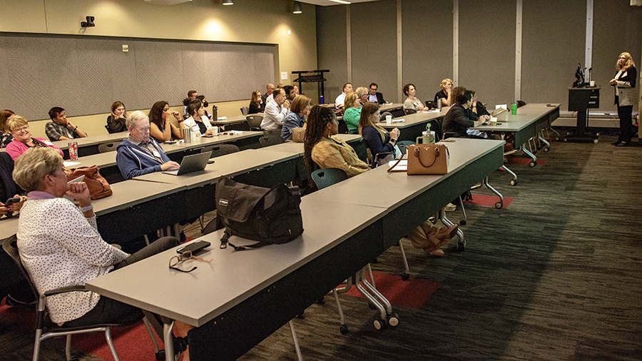 Faculty participate in training during development sessions.