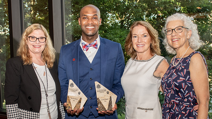 Dr Stewart with Awards