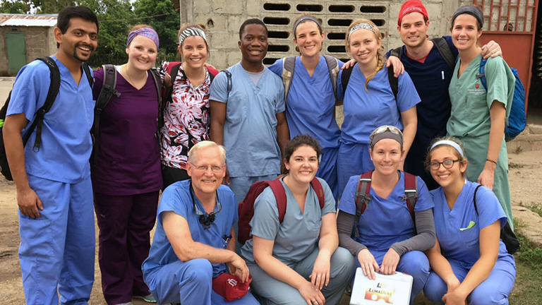 student doctors pose as a group