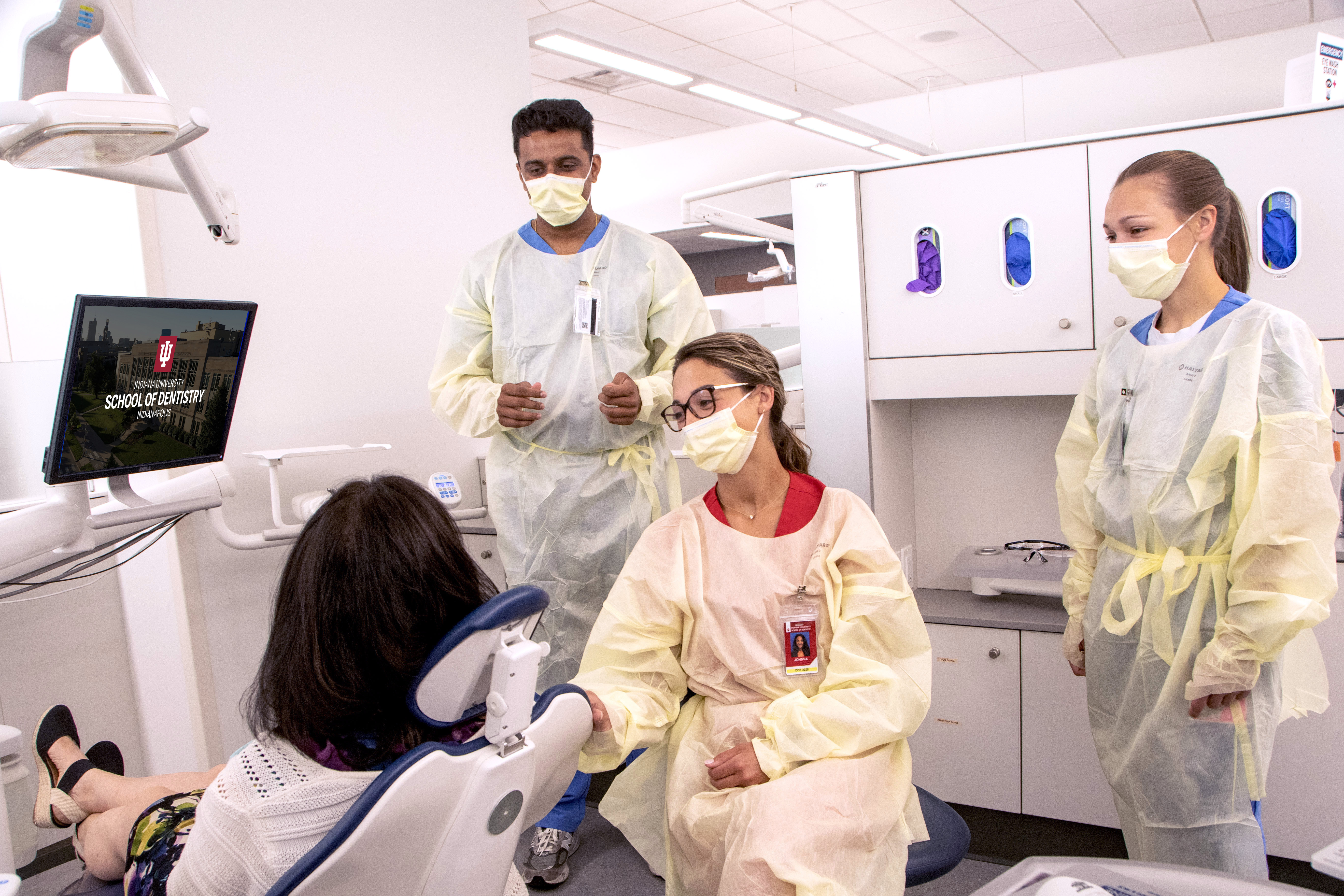 a patient in clinic with a team of students